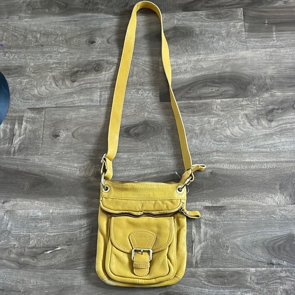 Tano brand leather crossbody with zipper top and front snap closure on pocket - Picture 1 of 7